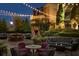 Inviting outdoor patio with comfortable seating, a fireplace, and lush landscaping at 88 W Paces Ferry Nw Rd # 1740, Atlanta, GA 30305
