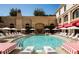 Resort-style pool area with lounge chairs, umbrellas, and beautifully landscaped grounds at 88 W Paces Ferry Nw Rd # 1740, Atlanta, GA 30305