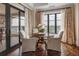 Sitting area with a table and seating, a large window, access to a balcony and herringbone floors at 88 W Paces Ferry Nw Rd # 1740, Atlanta, GA 30305