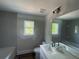 Well-lit bathroom features a large mirror and natural light at 151 Sunshower Rdg, Canton, GA 30114