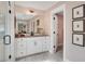 Elegant bathroom with a shower, tile flooring, and a modern vanity with black accents at 151 Sunshower Rdg, Canton, GA 30114