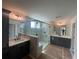 Modern bathroom featuring dual vanities, a walk-in shower, and contemporary lighting at 151 Sunshower Rdg, Canton, GA 30114