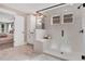 Luxurious bathroom with a glass shower, white cabinets, and marble tile flooring at 151 Sunshower Rdg, Canton, GA 30114