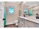 Bathroom with double vanity sinks, modern fixtures, and great natural light at 151 Sunshower Rdg, Canton, GA 30114