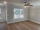 Bright bedroom featuring a ceiling fan and large windows, providing plenty of natural light at 151 Sunshower Rdg, Canton, GA 30114