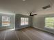 Bright bedroom featuring multiple windows, a ceiling fan, and natural light throughout at 151 Sunshower Rdg, Canton, GA 30114
