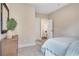 Comfortable bedroom with neutral tones, carpet, and doorway to connecting space at 151 Sunshower Rdg, Canton, GA 30114