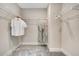 Walk-in closet features shelving and ample space for clothing storage at 151 Sunshower Rdg, Canton, GA 30114