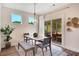Cozy dining room with lots of light and a sliding door leading to a screened in outdoor space at 151 Sunshower Rdg, Canton, GA 30114