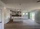 Open-concept kitchen features an island and modern pendant lighting at 151 Sunshower Rdg, Canton, GA 30114