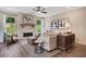 Inviting living room featuring a stone fireplace, hardwood floors, and large windows with beautiful views at 151 Sunshower Rdg, Canton, GA 30114