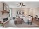 Inviting living room with a stone fireplace, modern furnishings, neutral decor, and plenty of natural light at 151 Sunshower Rdg, Canton, GA 30114