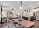 Spacious open-concept living space with kitchen island, dining area, and living room with lots of natural light at 151 Sunshower Rdg, Canton, GA 30114