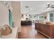 Hallway looking into a living space with a kitchen island and dining table at 151 Sunshower Rdg, Canton, GA 30114