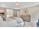 Bright main bedroom featuring a tray ceiling, modern dresser, and ensuite bathroom at 151 Sunshower Rdg, Canton, GA 30114
