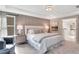 Spacious main bedroom with a tray ceiling, sitting area, and an ensuite bathroom at 151 Sunshower Rdg, Canton, GA 30114