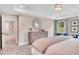 Bright bedroom with a tray ceiling, neutral-toned walls, and an ensuite bathroom at 151 Sunshower Rdg, Canton, GA 30114