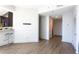 Spacious living room area with hardwood floors and a view into the kitchen at 1080 Peachtree Ne St # 1408, Atlanta, GA 30309