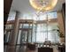 Grand lobby with high ceilings, modern lighting, and elegant seating, creating a luxurious and welcoming entrance at 1080 Peachtree Ne St # 1408, Atlanta, GA 30309