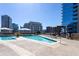 Luxury rooftop pool with sun loungers and umbrellas offering a serene retreat with cityscape backdrop at 1080 Peachtree Ne St # 1408, Atlanta, GA 30309