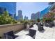 Relaxing rooftop terrace with comfortable seating and stunning city views, perfect for outdoor entertaining at 1080 Peachtree Ne St # 1408, Atlanta, GA 30309