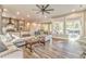 Open-concept living room featuring hardwood floors, large windows, and comfortable seating area at 49 Allison Dr, Dallas, GA 30157