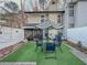 Private backyard with patio furniture and artificial turf at 4359 Idlewood Ln, Tucker, GA 30084