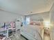 Bright bedroom with a queen bed, workspace, and access to a bathroom at 4359 Idlewood Ln, Tucker, GA 30084