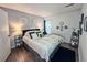 Comfortable bedroom with plush bedding, stylish decor, and ample natural light at 4359 Idlewood Ln, Tucker, GA 30084