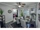 Dining room featuring modern decor, ceiling fan, and access to the living room at 4359 Idlewood Ln, Tucker, GA 30084