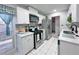 Modern kitchen with stainless steel appliances and white cabinets at 4359 Idlewood Ln, Tucker, GA 30084
