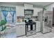 Bright eat-in kitchen, stainless steel appliances, and white cabinets at 4359 Idlewood Ln, Tucker, GA 30084