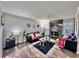 Stylish living room with modern fireplace, sleek furnishings, and hardwood floors at 4359 Idlewood Ln, Tucker, GA 30084