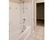 Bathroom with tub and shower, and beige tile at 1850 Cotillion Dr # 3221, Dunwoody, GA 30338
