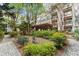 Landscaped courtyard with walking paths and pergola at 1850 Cotillion Dr # 3221, Dunwoody, GA 30338
