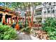 Relaxing courtyard with pergola, brick walkways, and lush landscaping at 1850 Cotillion Dr # 3221, Dunwoody, GA 30338