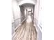 Bright hallway with hardwood floors and neutral paint at 1850 Cotillion Dr # 3221, Dunwoody, GA 30338