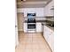 Modern kitchen with white cabinets, granite countertops, and stainless steel appliances at 1850 Cotillion Dr # 3221, Dunwoody, GA 30338