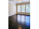 Bright living room with hardwood floors and large windows at 1850 Cotillion Dr # 3221, Dunwoody, GA 30338