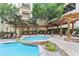 Resort-style pool with spa, waterfall feature, and lounge area at 1850 Cotillion Dr # 3221, Dunwoody, GA 30338