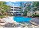 Community pool with a spa and plenty of lounge chairs at 1850 Cotillion Dr # 3221, Dunwoody, GA 30338