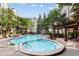 Inviting pool and spa area with lounge chairs and pergola at 1850 Cotillion Dr # 3221, Dunwoody, GA 30338