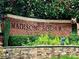 Madison Square brick sign with lush greenery, stone base, and mature trees adding to the community's charm at 1850 Cotillion Dr # 3221, Dunwoody, GA 30338