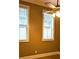 Bedroom with two windows, neutral walls, and a ceiling fan at 2380 Crescent Park Ct # 4, Atlanta, GA 30339