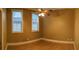 Bedroom with hardwood floors, two windows with blinds, and a ceiling fan at 2380 Crescent Park Ct # 4, Atlanta, GA 30339