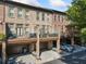 Brick townhomes with balconies, garages, and street parking visible at 2380 Crescent Park Ct # 4, Atlanta, GA 30339