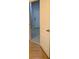 Hallway with hardwood floors and a white door slightly ajar at 2380 Crescent Park Ct # 4, Atlanta, GA 30339