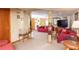 Finished basement with red couches and a TV at 3208 Edgemont Way, Decatur, GA 30032