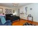 Main bedroom with black bedding and hardwood floors at 3208 Edgemont Way, Decatur, GA 30032