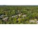 Aerial view of luxury homes nestled amongst lush greenery, offering privacy and a sense of seclusion at 980 Fenimore Cir, Sandy Springs, GA 30350